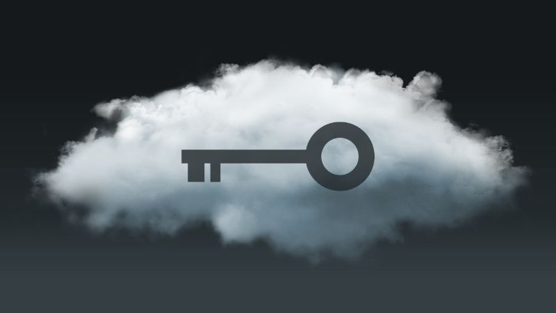 key silhouetted against a cloud