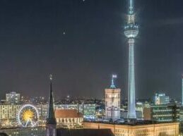 View over the River Spree to Nikolaiviertel and Alexanderplatz at night
